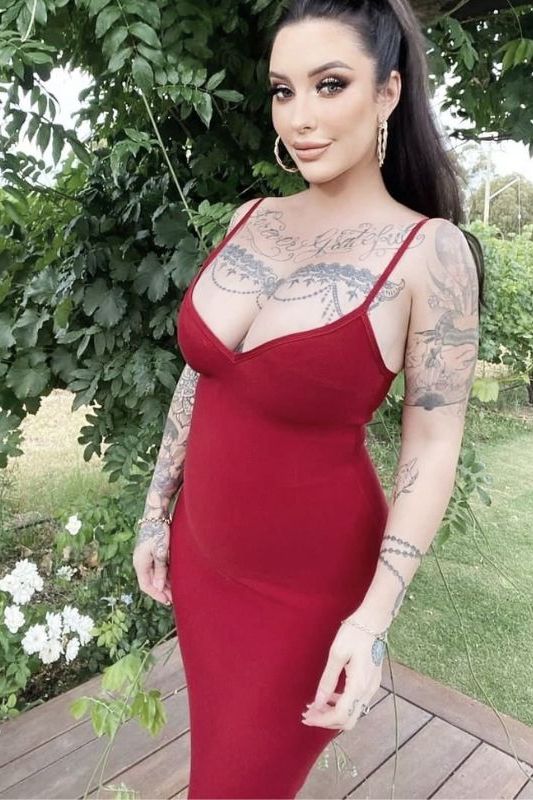 Woman wearing a figure flattering  Blanche Bandage Midi Dress - Lipstick Red BODYCON COLLECTION